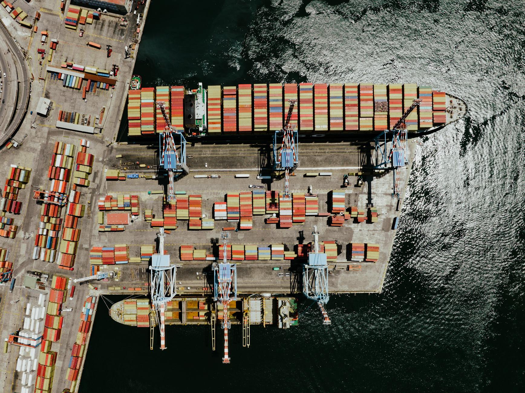 Aerial shot of colorful cargo containers at the bustling port in Napoli, Italy.